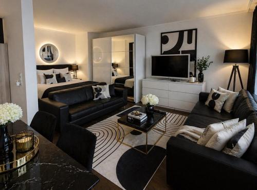 a living room with a couch and a bed at Executive Suite-Business Edition in Zurich