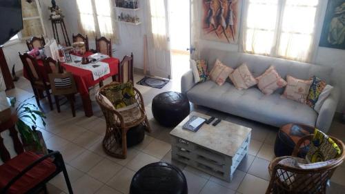 a living room with a couch and a table at Habitation Joseph in Trou dʼ Eau Douce