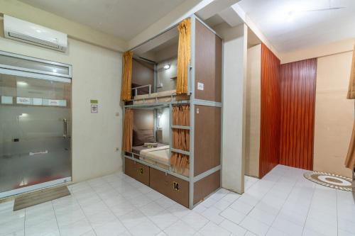 a large bathroom with a sink and a shower at Aru House Ubud in Ubud