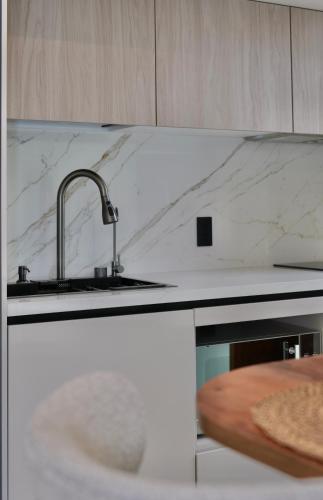 a kitchen with a sink and a counter top at Cielo Apartments with top amenities in Quito
