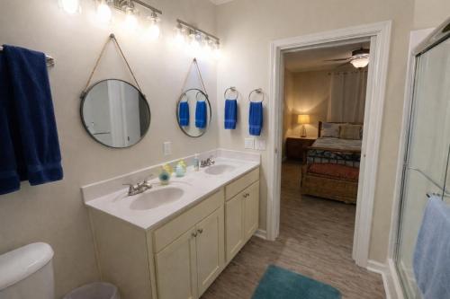 a bathroom with a sink and a mirror at Beautiful Pensacola beach house in Pensacola Beach