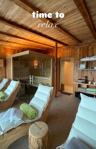 a room with two beds and a sign that reads time to relax at Kerschbamerhof im Süden Südtirols in Cortaccia