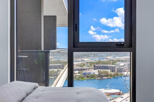 a room with a window with a view of the water at Miami Skyline Escape in Miami