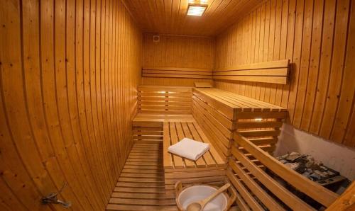 a wooden sauna with a toilet in it at Hotel Im Schwedischen Hof in Binz