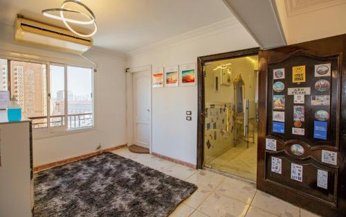 a room with a door to a room with a window at Nile X Hostel - Nile view in Cairo