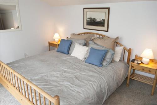 a bedroom with a large bed with blue pillows at Dollar Meadows #1373 in Sun Valley