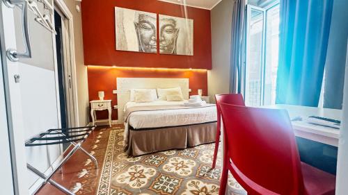 a hotel room with a bed and a bathroom at Duomo Charming Rooms in Barletta