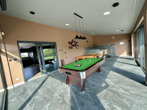 a room with a pool table in a house at Podlaski Chill in Przejma Wielka