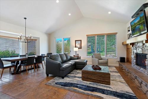 a living room with a couch and a fireplace at Piney Ridge TR6 Hot Tub Pool in Eden