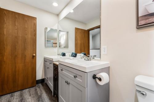 a bathroom with a sink and a mirror at Seasons Alpine Retreat in Avon