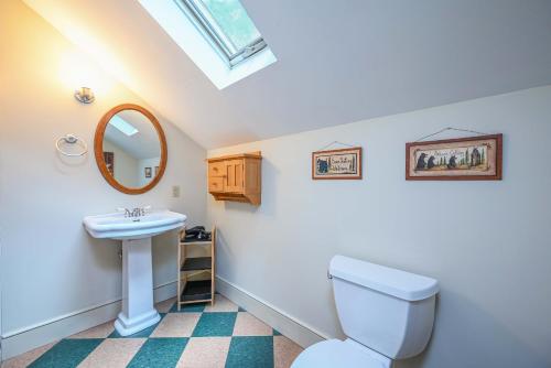 a bathroom with a toilet and a sink at The Wander Inn in Black Mountain