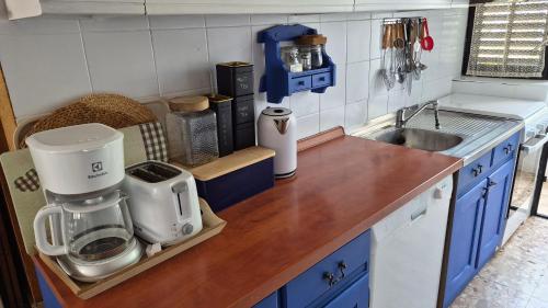 a kitchen with a counter with a coffee maker on it at House Brunac with parking in Vodice