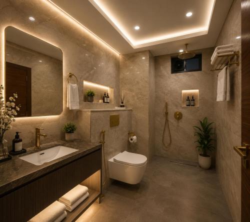 a bathroom with a sink and a toilet and a mirror at Hotel City Palace in Pānīpat