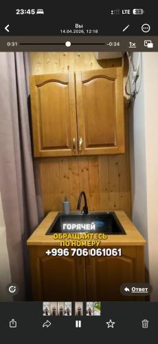 a picture of a kitchen with a sink and cabinets at BonHome квартиры in Bulan Sogottuu