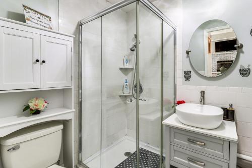a white bathroom with a shower and a sink at Lake Access & Game Room! Poconos Resort Getaway in Tobyhanna