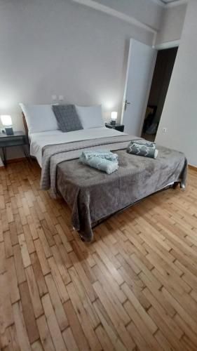 a bedroom with a bed with two pillows on it at P&M House in Agrinio