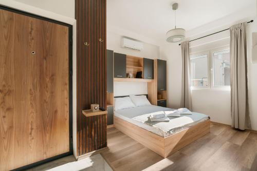 a bedroom with a large bed in a room at Bubbles 2 Apartments in Gevgelija
