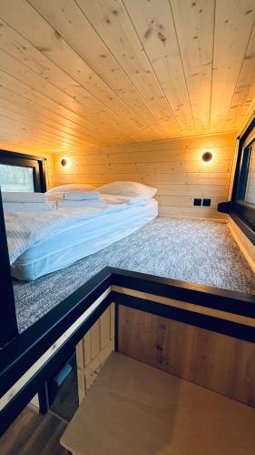 a room with two beds in a sauna at Mazurski Widok 2 in SzczybaÅ‚y OrÅ‚owskie