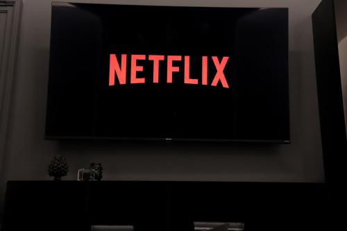 a television with a netflix sign on a wall at 115 Luxury Suite - Privitera in Grammichele