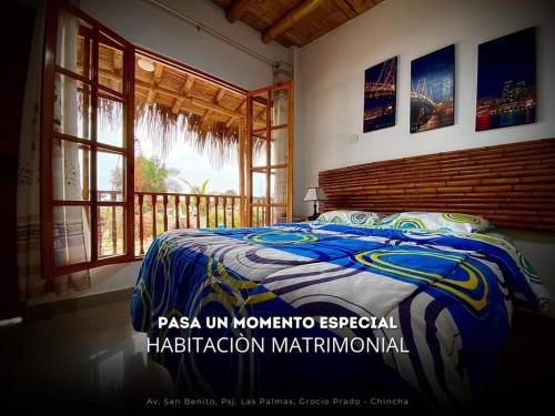 a bedroom with a bed and a window at Hacienda Hotel Colpa in Chincha