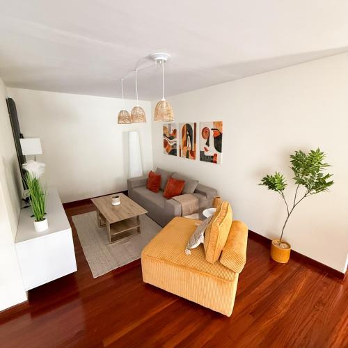 a living room with a couch and a table at Piso en el Corazón de Ferrol in Ferrol