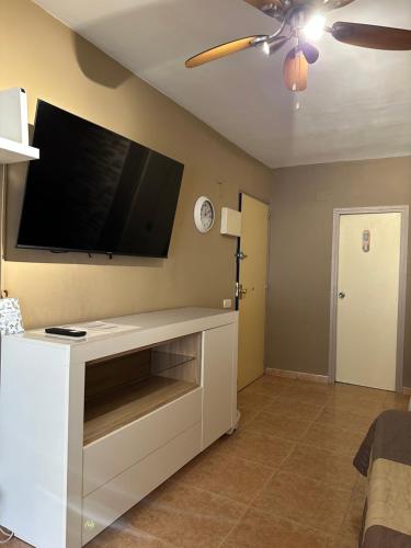 a living room with a flat screen tv on the wall at Promar Playa 255 in La Pineda