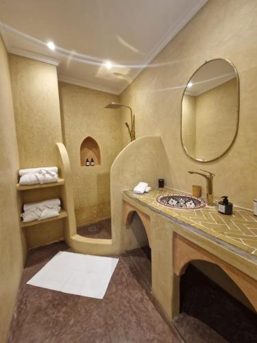 a bathroom with a sink and a shower at Riad Dar Yamna Marrakech in Marrakesh