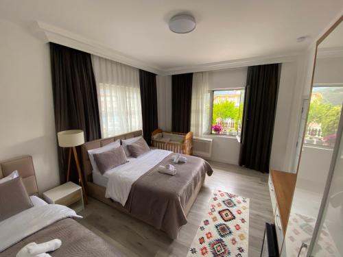 a hotel room with a bed and a window at Guest House Nuhellari 2 in Çorovodë