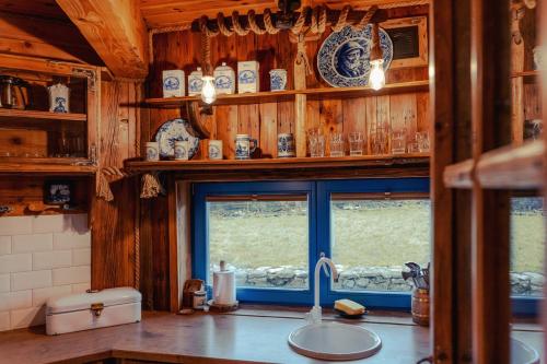 a kitchen with a sink and a window at Tylko Dobro Siedlisko na Jurze in Pabianice