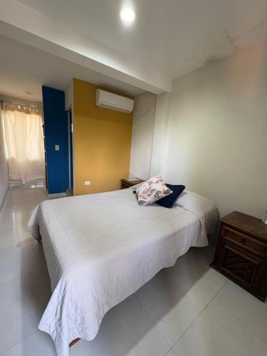 a bedroom with a bed with a pillow on it at Portal de José - Hotel Boutique in Ciudad Valles