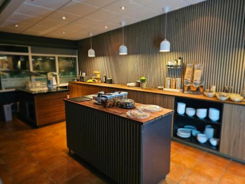 a kitchen with a counter top in a restaurant at Hótel Austur in Reyðarfjörður