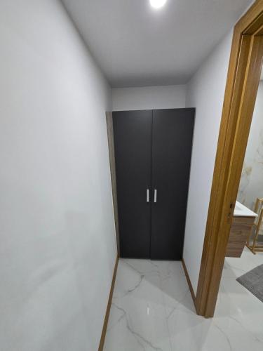 a black cabinet in a room with white walls at Boeing AL Q1 in Moreira