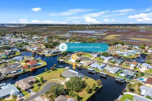 an aerial view of a city with a harbor at 1480 W Riviera Dr in Merritt Island