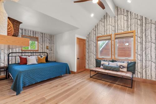 a bedroom with a bed with a blue comforter at Stella del Mare in Dover ID in Dover