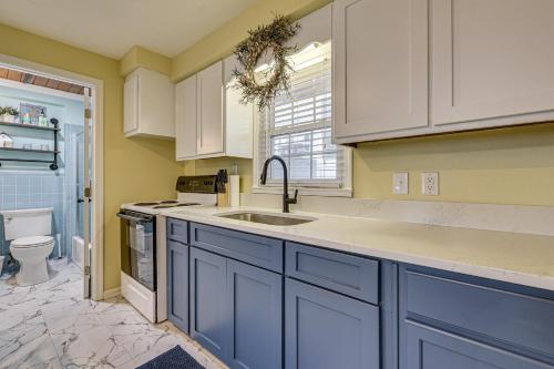 a kitchen with blue cabinets and a sink at Steps to Beach! North Myrtle Beach (Cherry Grove) in Myrtle Beach
