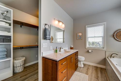 a bathroom with a sink and a toilet at Hot Tub & Seasonal Pool: Remarkable Yakima Getaway in Yakima