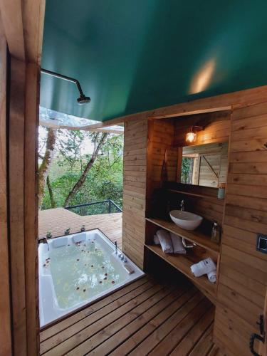 a bathroom with a jacuzzi tub and a sink at Sirio in San Francisco