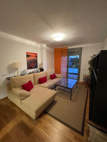 a living room with a couch and a table at Apartamento Robledal de Cirueña in Cirueña