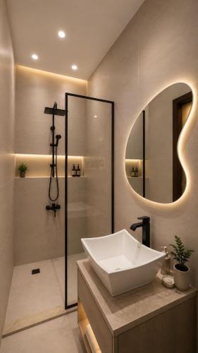 a bathroom with a sink and a shower and a mirror at Cacillion Pyramids View in Cairo