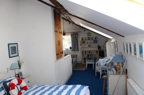 a bedroom with a bed and a room with a hallway at Clayton Wickham Farmhouse in Hurstpierpoint