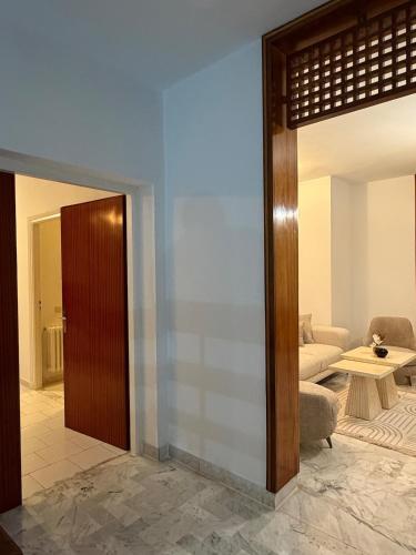 a living room with a couch and a table at Villa Marsa in Dar el Haj Ahmed Souid