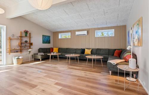 a living room with a couch and tables at Beautiful Home In Ejstrupholm in Krejbjerg