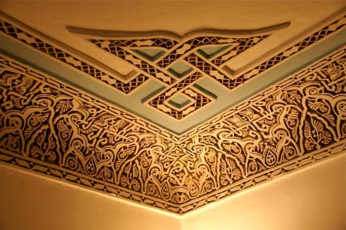 a coffered ceiling with intricate patterns in a room at Riad Laila in Marrakech