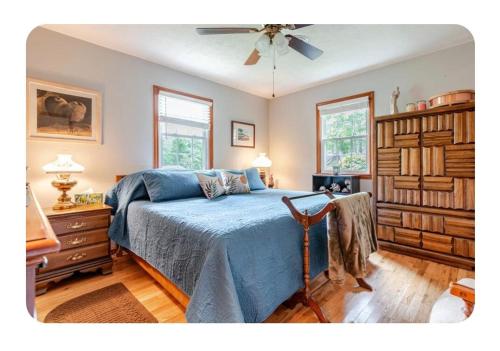 a bedroom with a bed and a ceiling fan at Bourbon Roost in Saint Francis