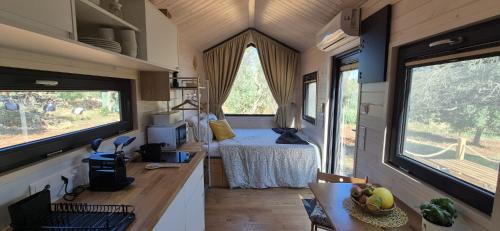a kitchen with a bed in a tiny house at Il Nostro Sogno - Madonna by Tiny Away in San Michele Salentino