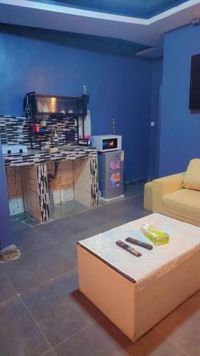 a living room with a couch and a table at Sunrise Lodging in Douala