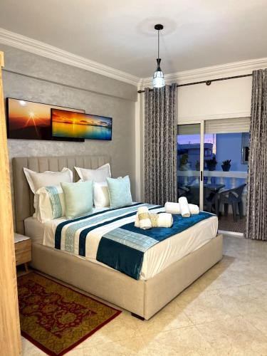 a bedroom with a large bed in a room at Cozy apartment center, Larache in Larache