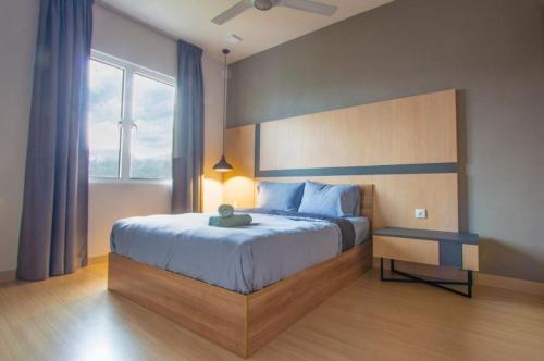a bedroom with a large bed and a large window at Genting Premium Suite Windmill Upon Hills by JAz Home Suites in Genting Highlands