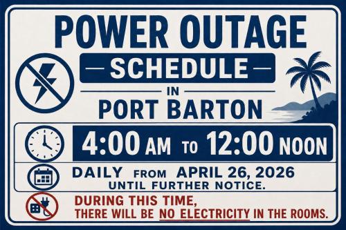 a sign that reads power outage schedule in port barion at Tribal Xperience Guesthouse in San Vicente