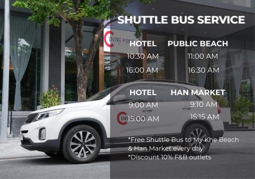 a white truck parked in front of a building at Centre Point Da Nang City Hotel - Afternoon Tea Inclusive in Danang
